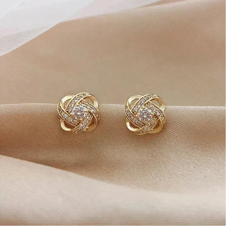 Lourdes, pendientes en espiral